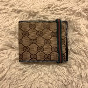 Monogram Gucci wallet with green and red band